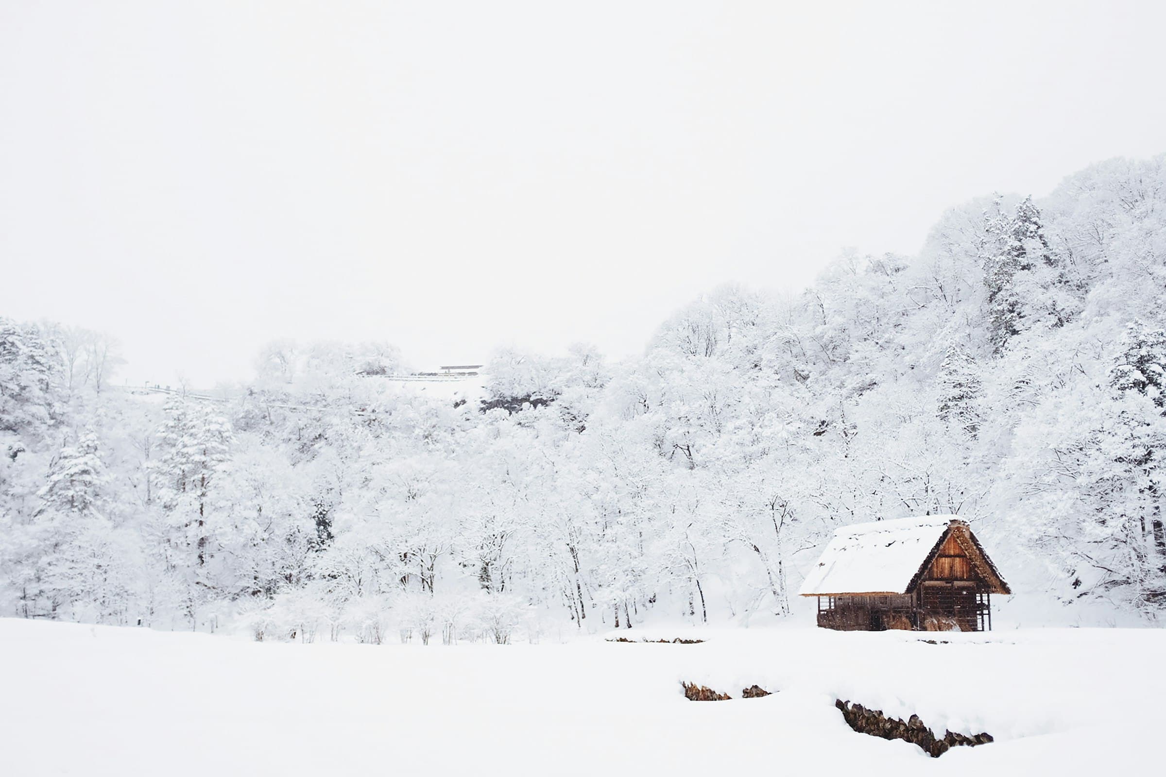 Snow-covered Long Island home at night